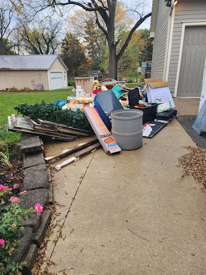 Dumpster being loaded with debris for 10 Yard Dumpster Rental in Blackshear